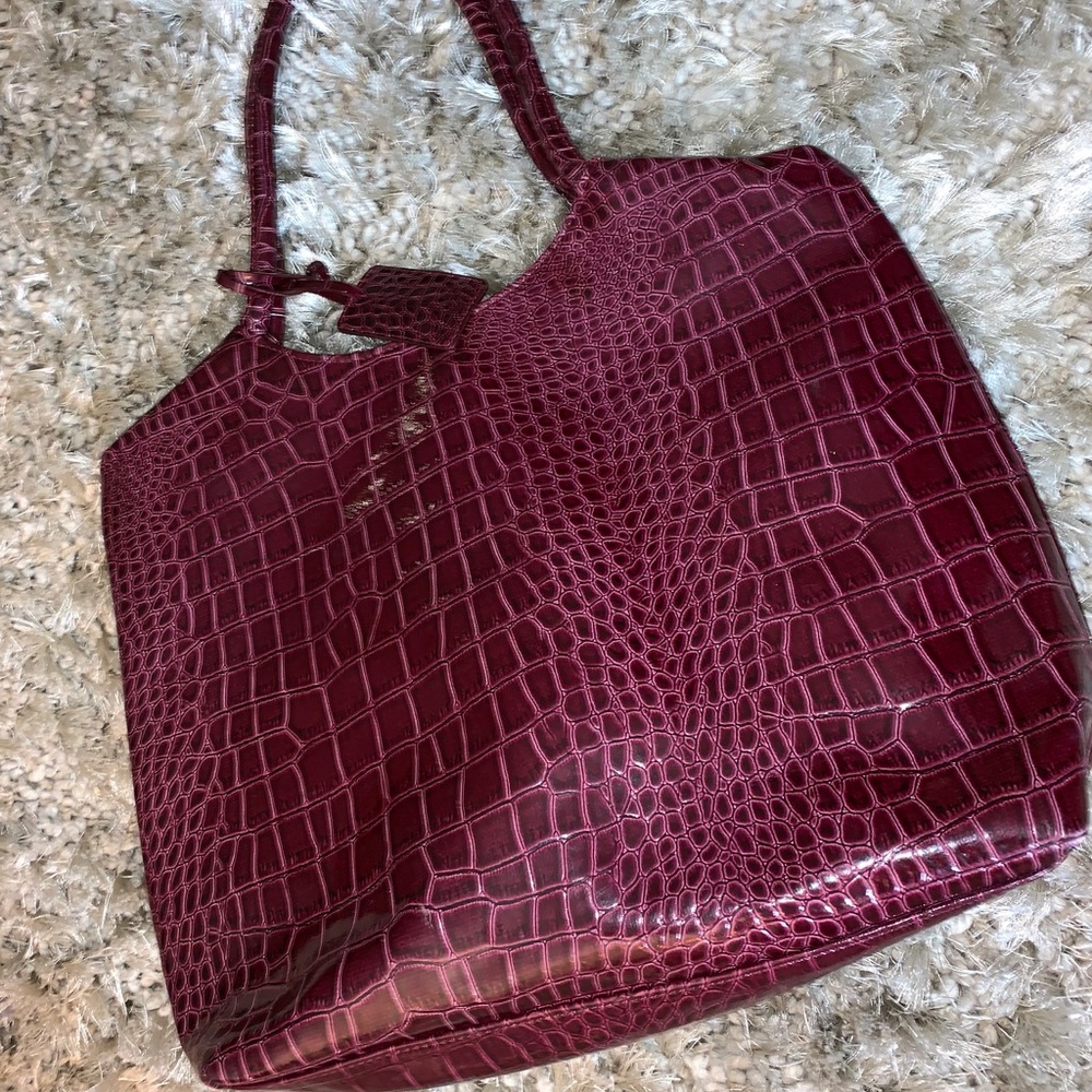 Neiman Marcus Crocodile embossed bordeaux tote.